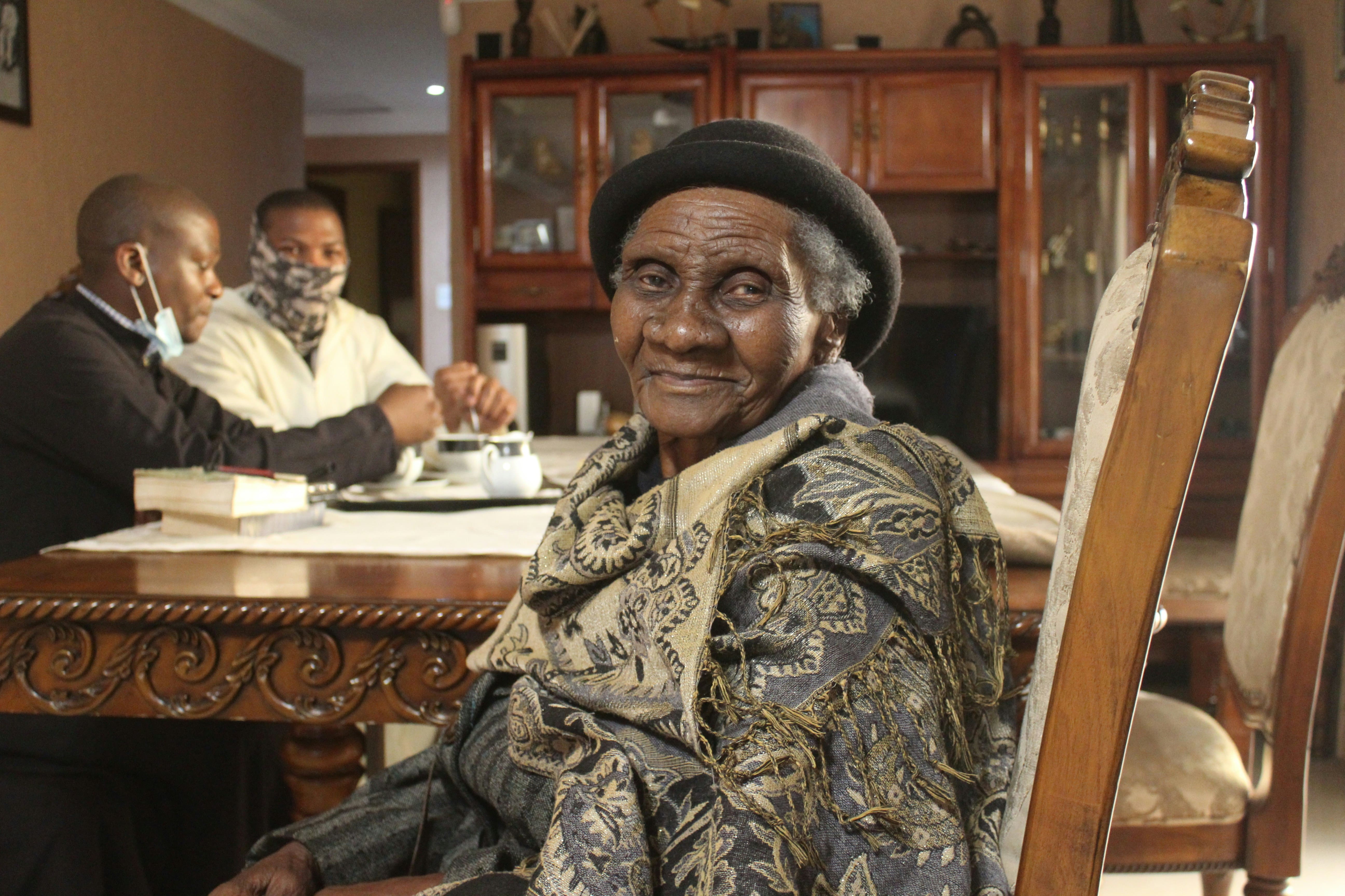 Caring nurse with elderly patient